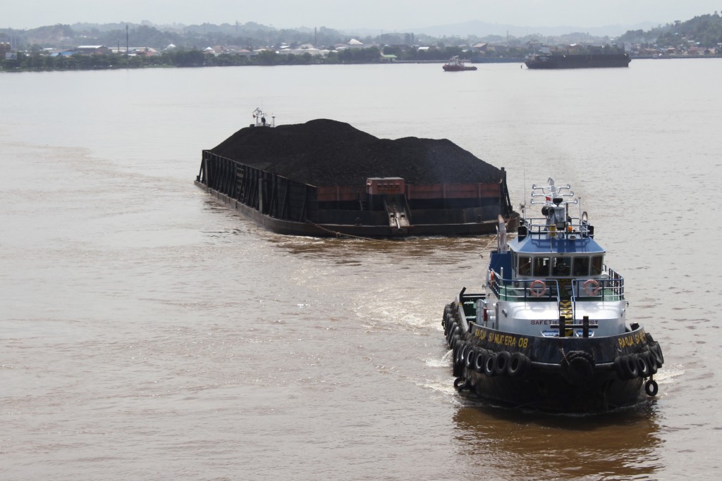 A coal barge from Samarinda coal mine on the Mahakam river. Indonesia, Borneo. June 15th 2013. Photograph: Andrew Taylor/WDM Creative Commons 