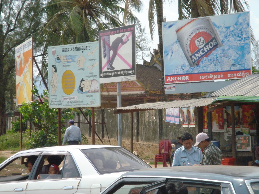 Banners of public services in Kampot province, Cambodia. Photo by Paul Nendick, taken on April 2, 2005. Licensed under Attribution-NonCommercial-NoDerivs 2.0 Generic (CC BY-NC-ND 2.0)